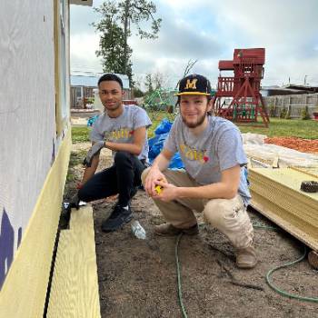 GCSC students helping install siding