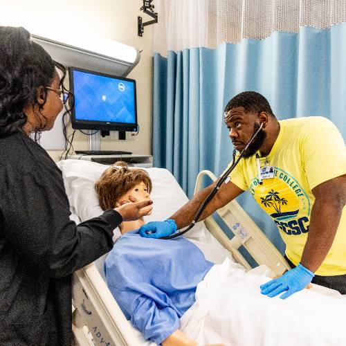 Nursing student listening to heart